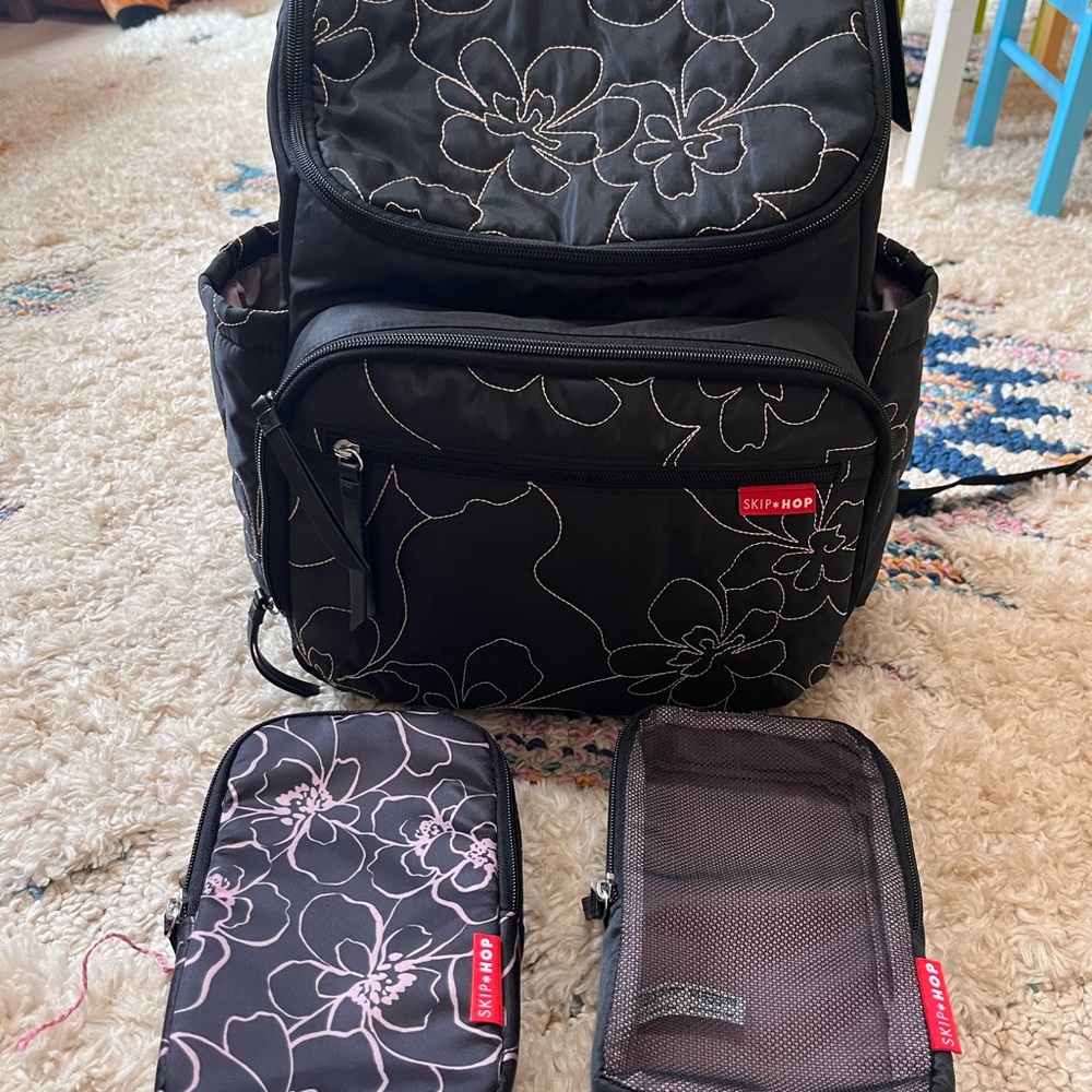 SkipHop diaper bag with 2 zipper storage bags